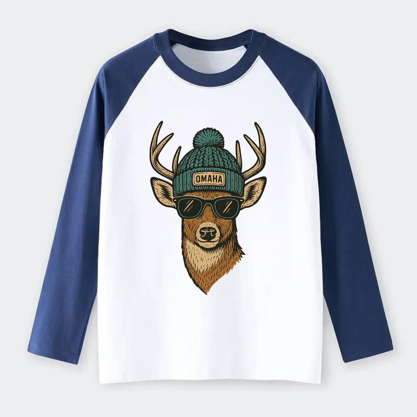 Nebraska White-tailed Deer wearing Omaha beanie with pom pom and - Raglan Long Sleeve T-Shirt - Blue