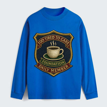Crest with coffee cup - "Too Tired To Care Foundation - Daily Member" - - Classic Long Sleeve Shirt - Blue
