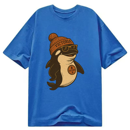 Victoria Orca wearing Victoria beanie with pom pom and wayfarer sunglasses - Classic T-shirt - Blue