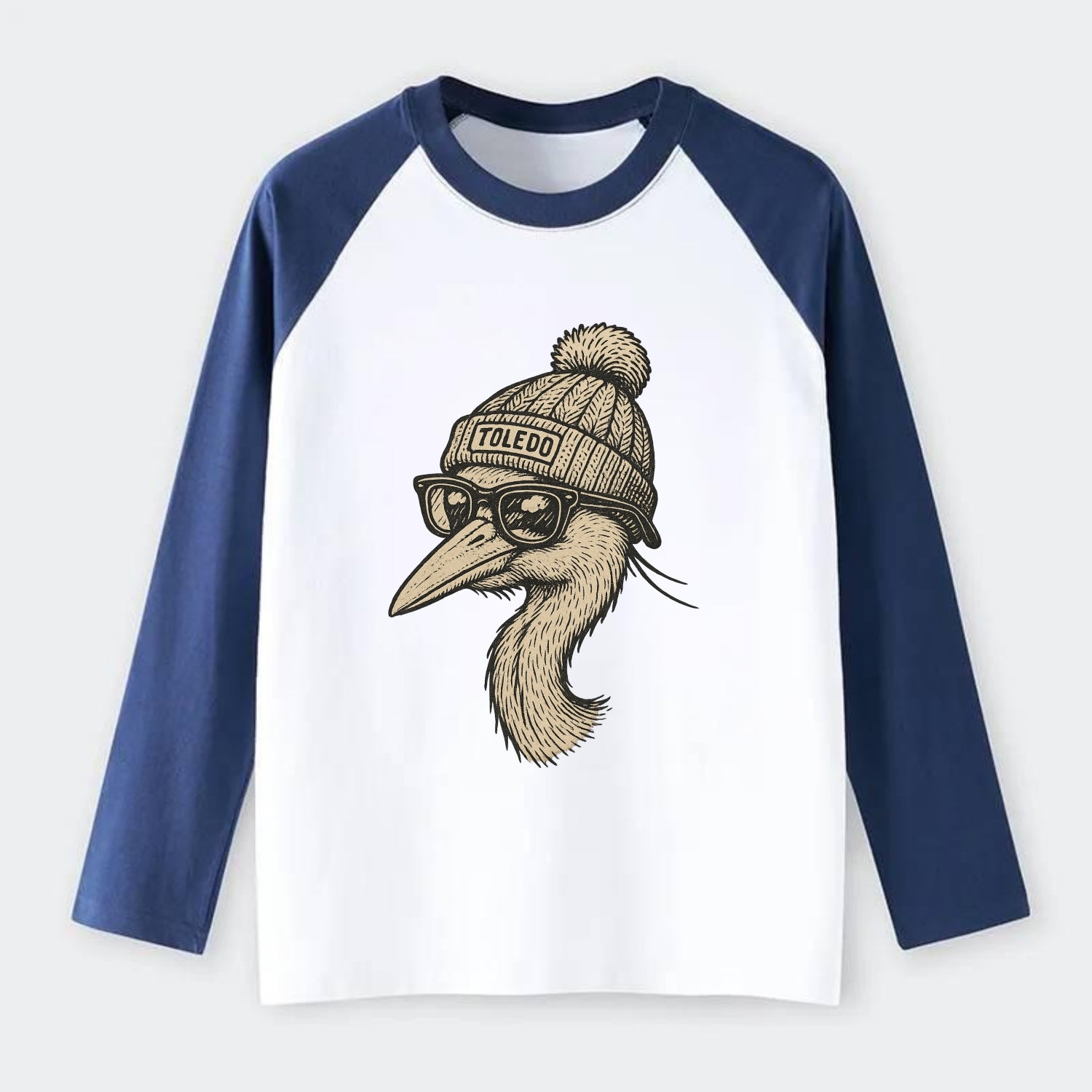 Toledo Great Blue Heron wearing Toledo beanie with pom pom and - Raglan Long Sleeve T-Shirt - Blue