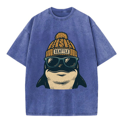 Seattle Orca wearing Seattle beanie with pom pom and wayfarer sunglasses - Vintage T-shirt - Blue