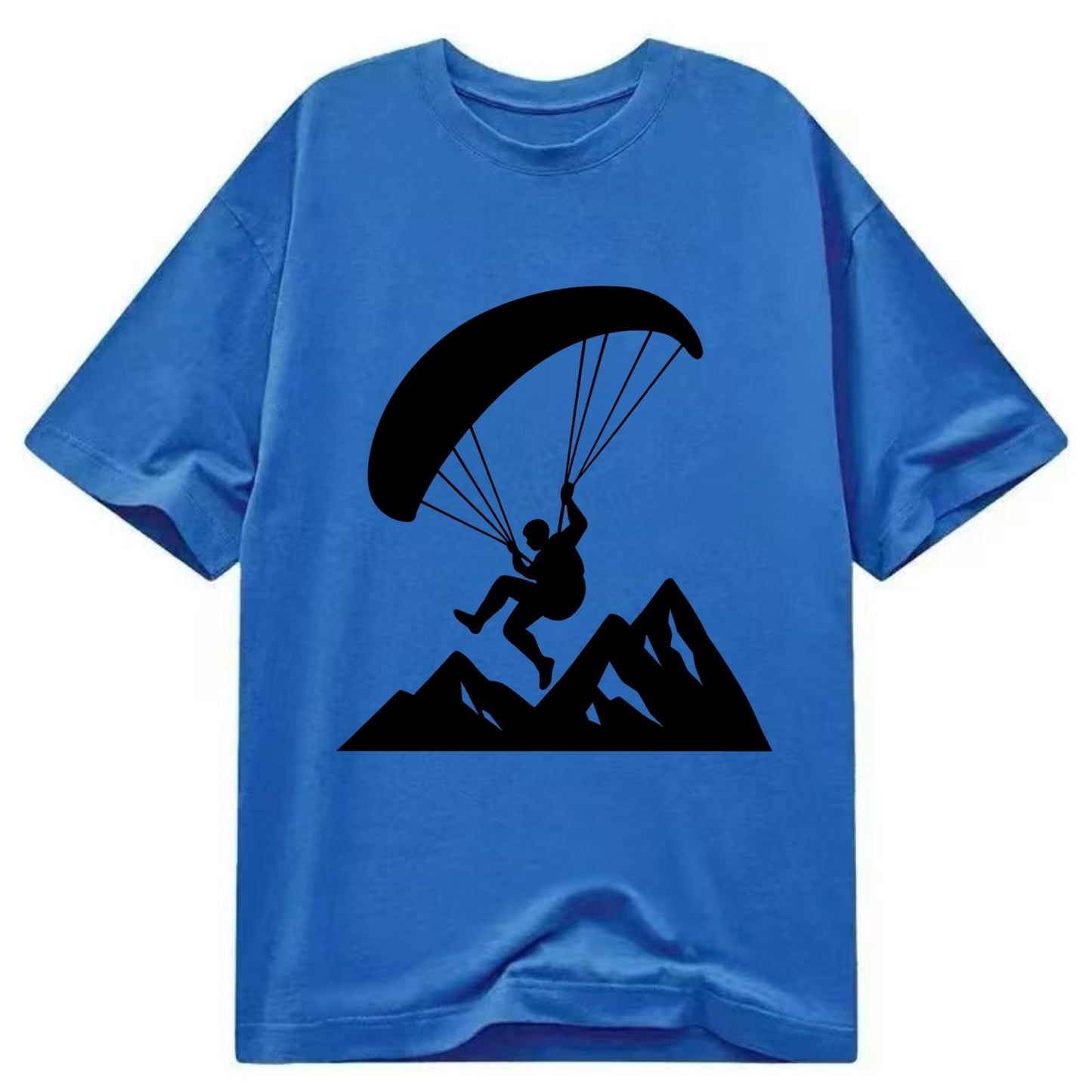 Paraglider soaring over mountain peaks - Classic T-shirt - Blue