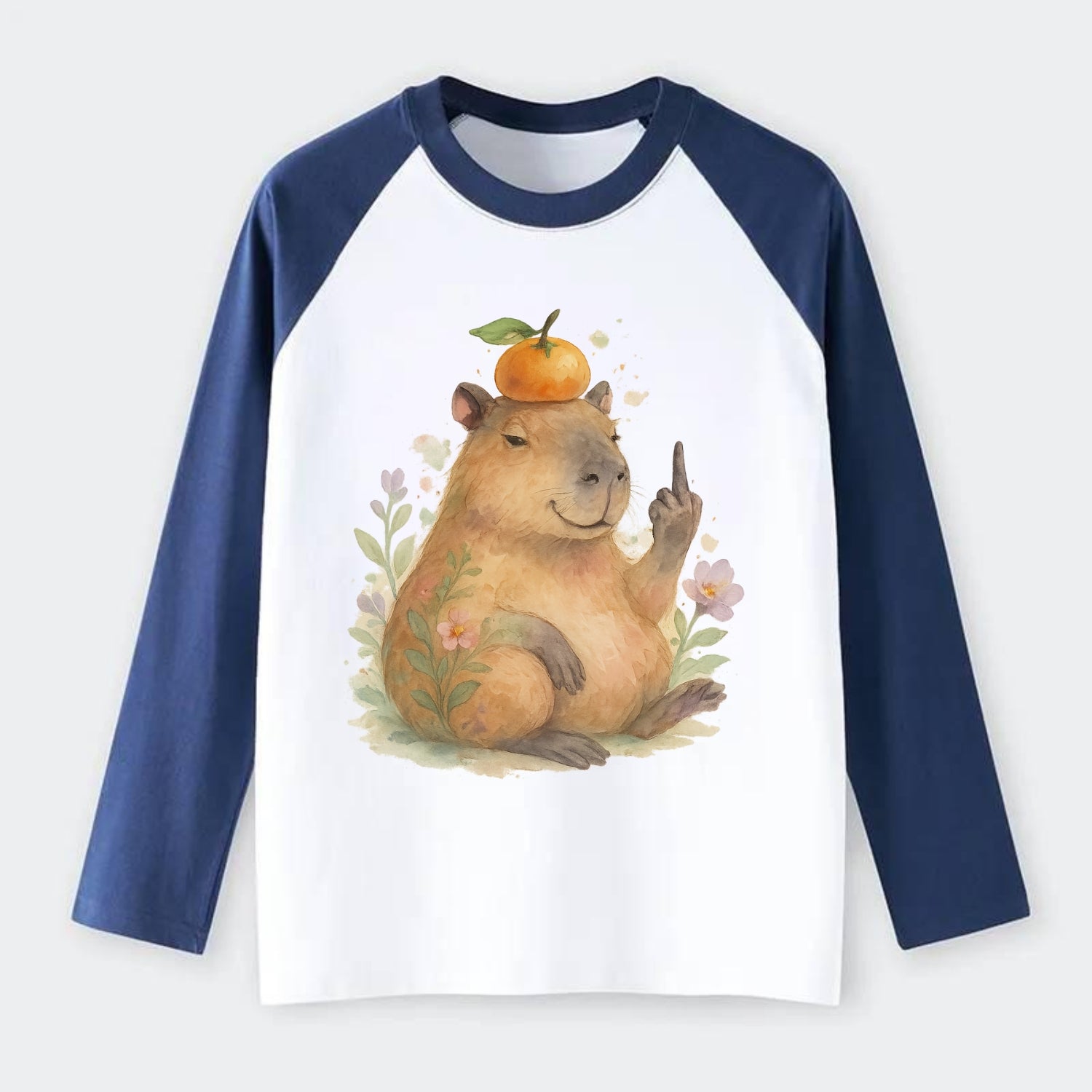 chonky capybara relaxing with orange on head, one webbed middle finger - Raglan Long Sleeve T-Shirt - Blue