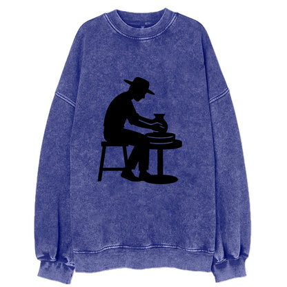Potter shaping clay on wheel - Vintage Sweatshirt - Blue
