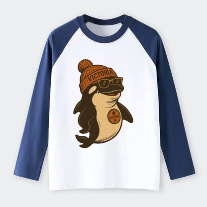 Victoria Orca wearing Victoria beanie with pom pom and wayfarer - Raglan Long Sleeve T-Shirt - Blue