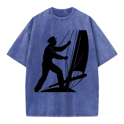 Sailor adjusting the boom on a sailboat - Vintage T-shirt - Blue