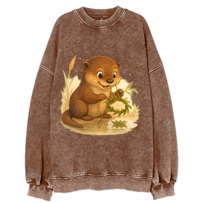 Otter weaving river reeds into a floating crown beside mirror-still water - Vintage Sweatshirt - Brown