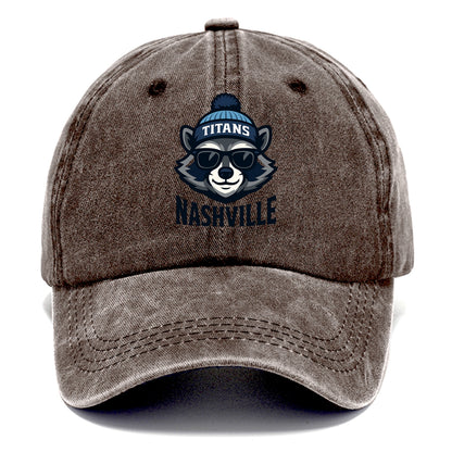 Nashville Raccoon wearing Titans navy and light blue beanie with pom pom and wayfarer - Classic Cap - Brown