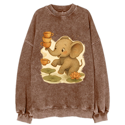 Elephant balancing teacups during a floating tea ceremony beside lotus ponds - Vintage Sweatshirt - Brown