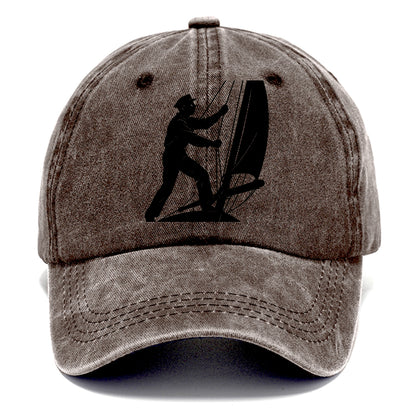 Sailor adjusting the boom on a sailboat - Classic Cap - Brown