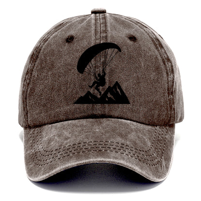 Paraglider soaring over mountain peaks - Classic Cap - Brown