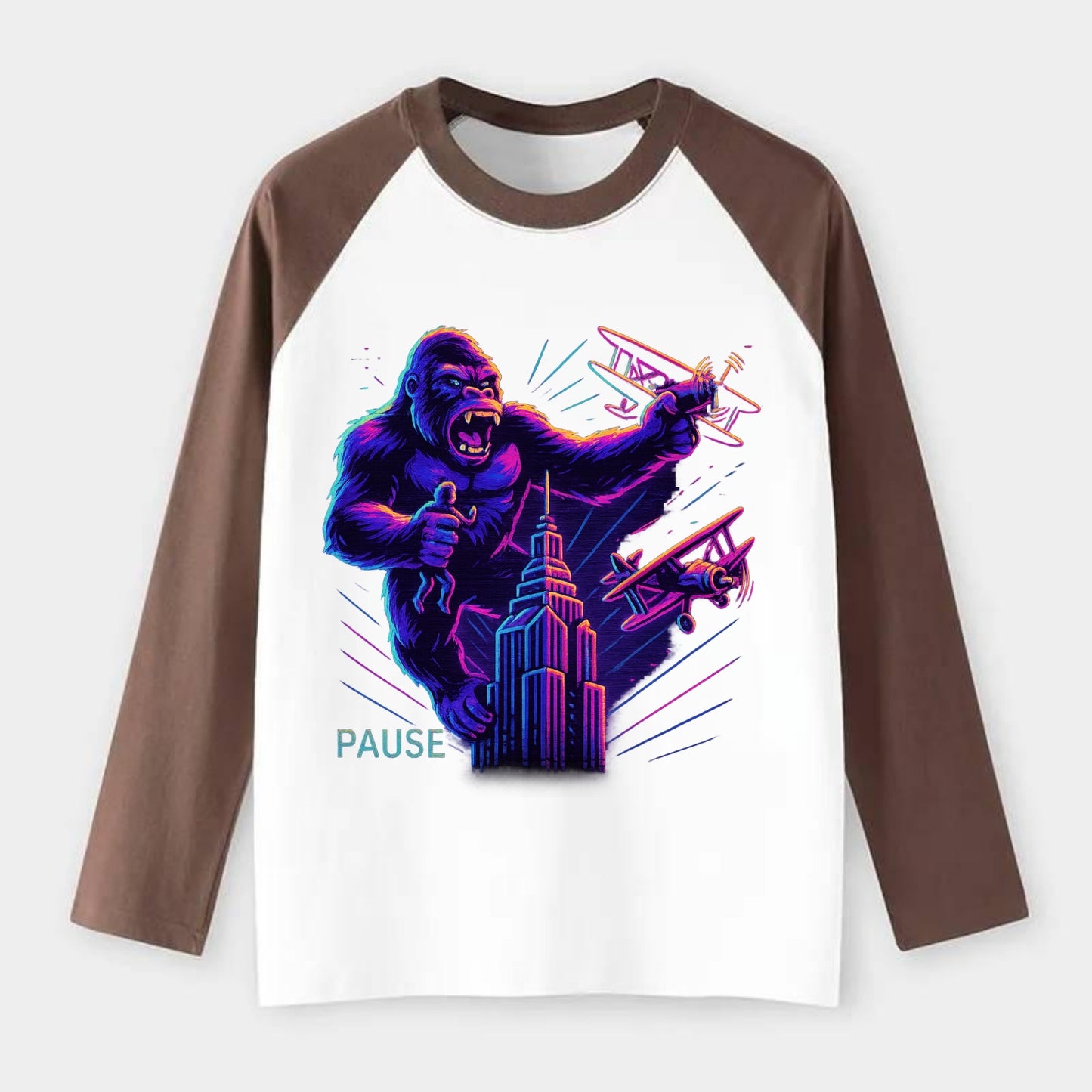 giant gorilla on top of skyscraper holding small figure, swatting - Raglan Long Sleeve T-Shirt - Coffee