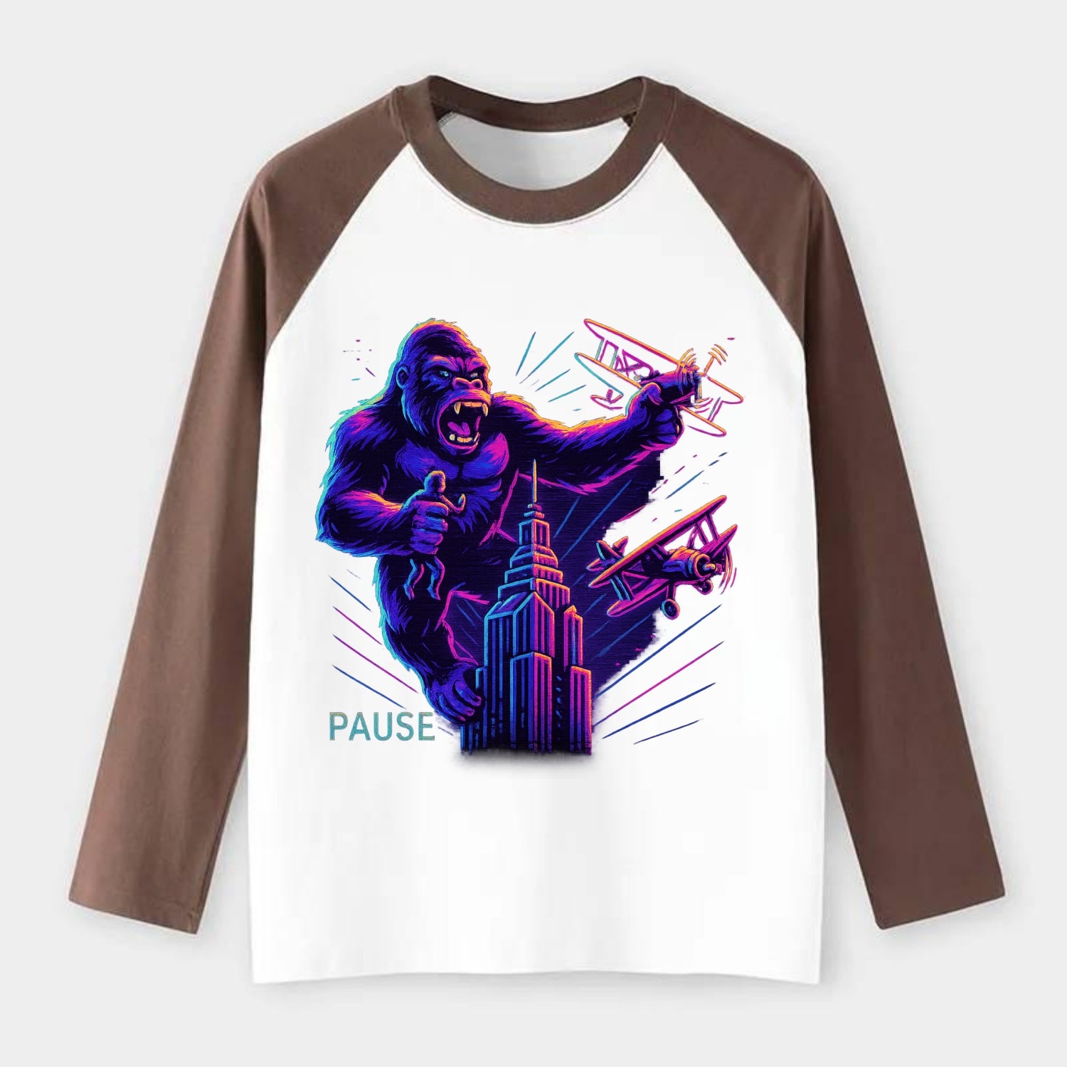 giant gorilla on top of skyscraper holding small figure, swatting - Raglan Long Sleeve T-Shirt - Coffee