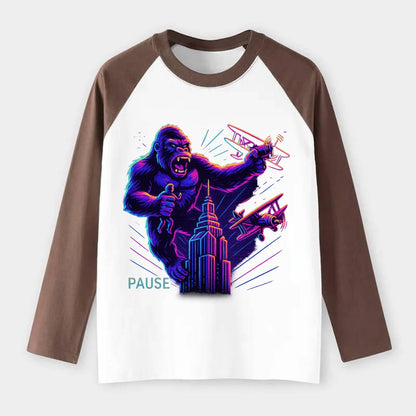 giant gorilla on top of skyscraper holding small figure, swatting - Raglan Long Sleeve T-Shirt - Coffee