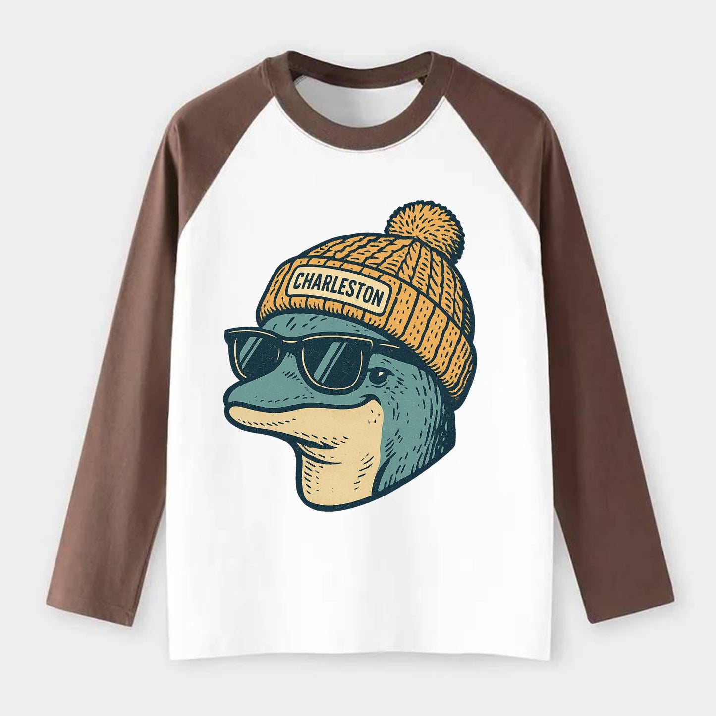 Charleston Dolphin wearing Charleston beanie with pom pom and wayfarer - Raglan Long Sleeve T-Shirt - Coffee