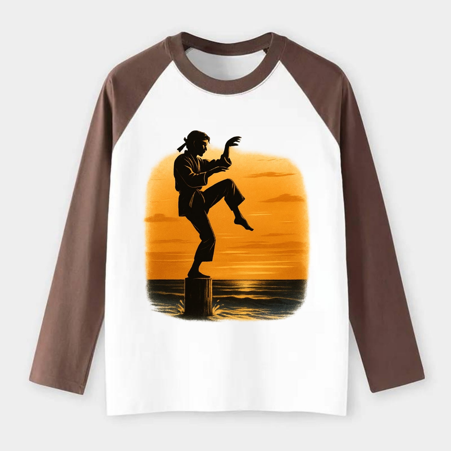 karate crane kick pose on wooden post at beach sunset - Raglan Long Sleeve T-Shirt - Coffee
