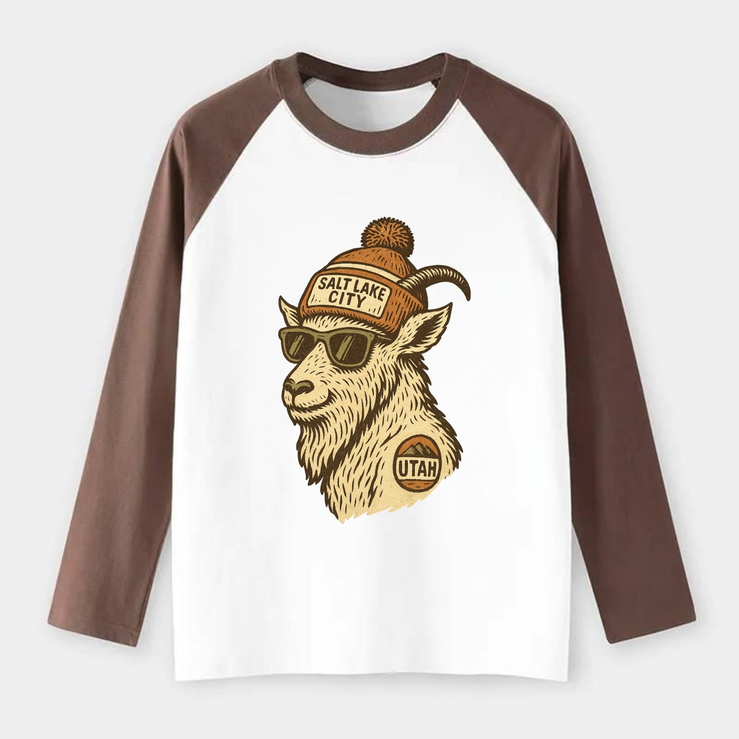 Utah Mountain Goat wearing Salt Lake City beanie with pom pom and - Raglan Long Sleeve T-Shirt - Coffee