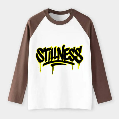 Bold typography design - "STILLNESS" - quiet power, peaceful presence - Raglan Long Sleeve T-Shirt - Coffee