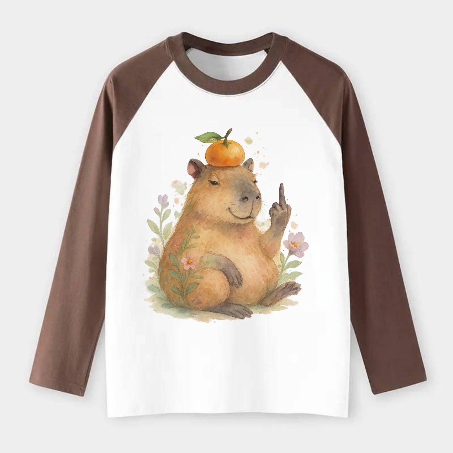chonky capybara relaxing with orange on head, one webbed middle finger - Raglan Long Sleeve T-Shirt - Coffee