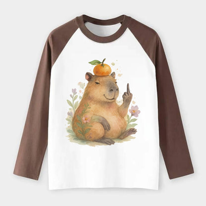 chonky capybara relaxing with orange on head, one webbed middle finger - Raglan Long Sleeve T-Shirt - Coffee