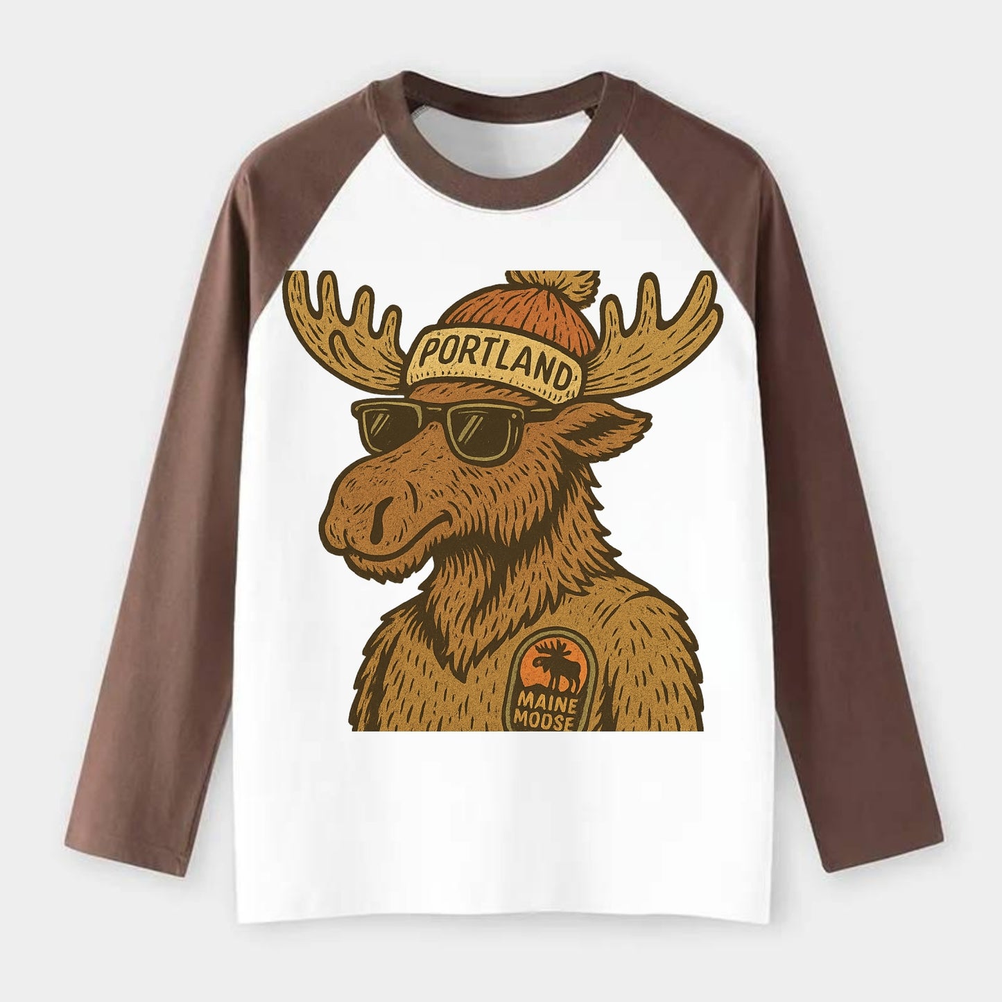 Maine Moose wearing Portland beanie with pom pom and wayfarer - Raglan Long Sleeve T-Shirt - Coffee