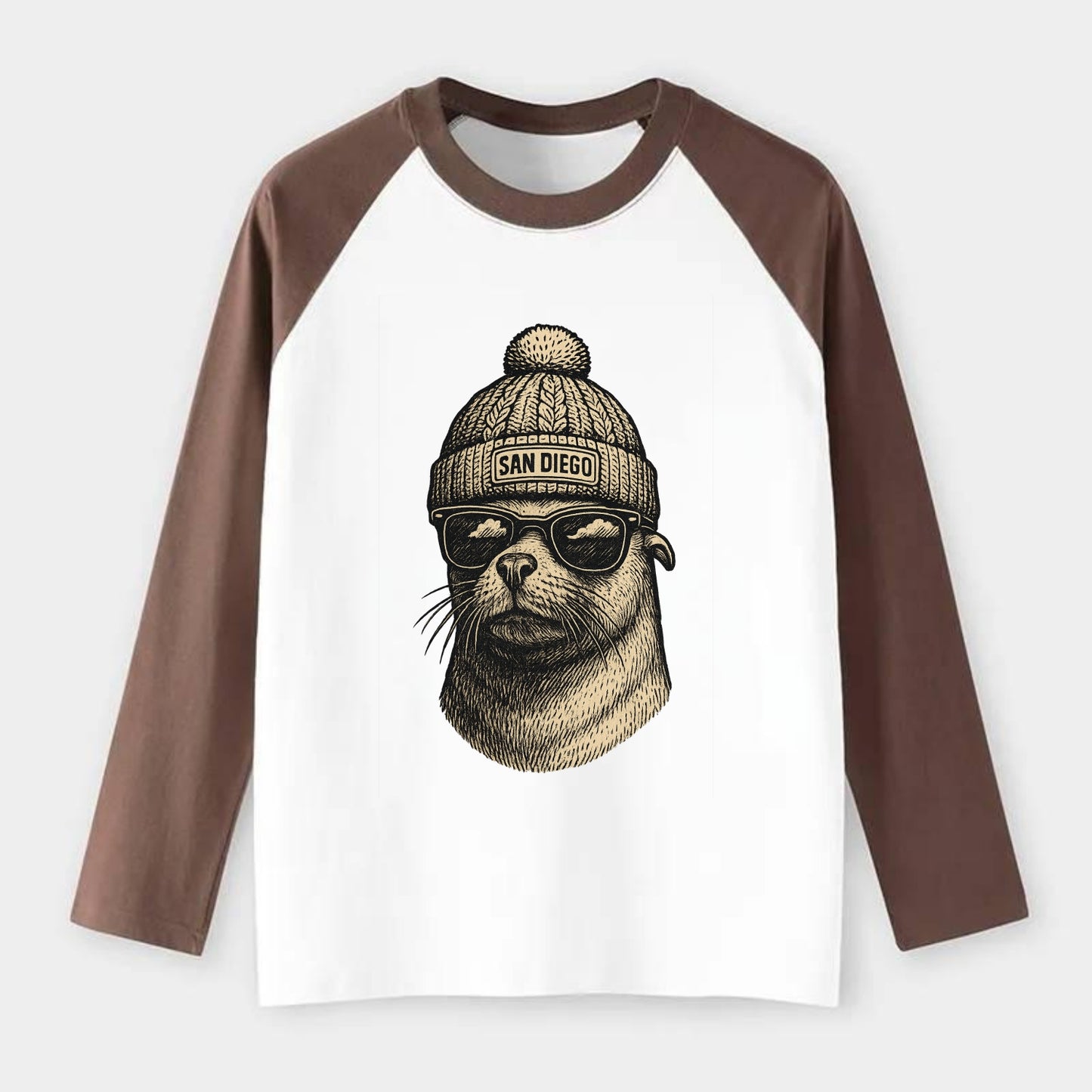 San Diego Sea Lion wearing San Diego beanie with pom pom and wayfarer - Raglan Long Sleeve T-Shirt - Coffee