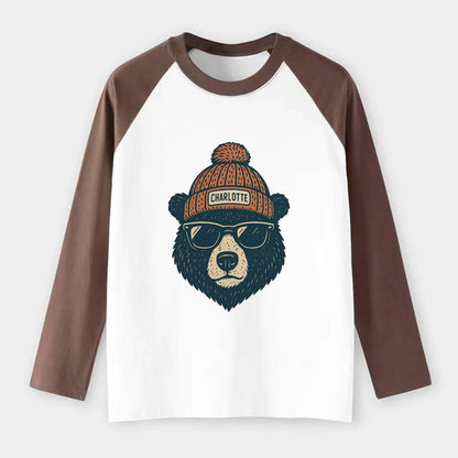 North Carolina Black Bear wearing Charlotte beanie with pom pom and - Raglan Long Sleeve T-Shirt - Coffee