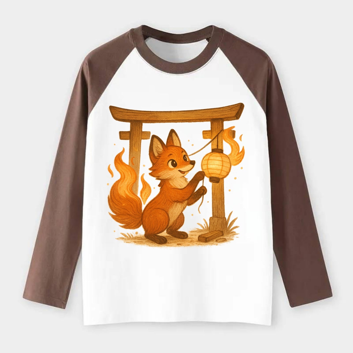 Foxfire kitsune stringing lanterns along a torii gate with tails of - Raglan Long Sleeve T-Shirt - Coffee