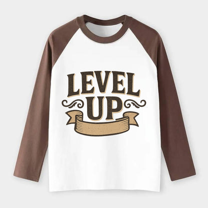 Bold typography design - "LEVEL UP" - improving, advancing, growing - Raglan Long Sleeve T-Shirt - Coffee