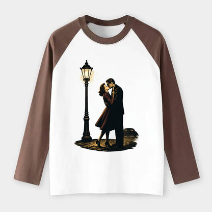 first kiss under vintage street lamp on cobblestone at night - Raglan Long Sleeve T-Shirt - Coffee