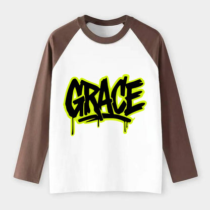 Bold typography design - "GRACE" - elegance under pressure, divine - Raglan Long Sleeve T-Shirt - Coffee