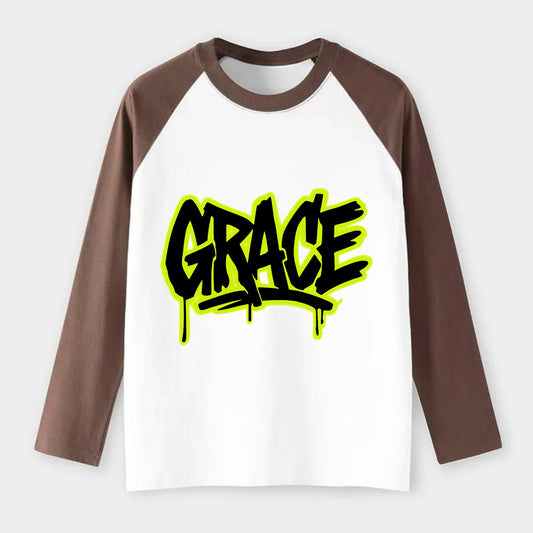 Bold typography design - "GRACE" - elegance under pressure, divine - Raglan Long Sleeve T-Shirt - Coffee