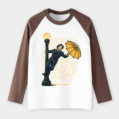 joyful dancing on lamppost in heavy rain with big smile - Raglan Long Sleeve T-Shirt - Coffee