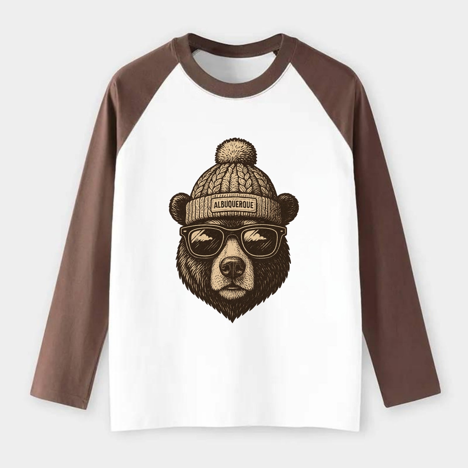 New Mexico Black Bear wearing Albuquerque beanie with pom pom and - Raglan Long Sleeve T-Shirt - Coffee