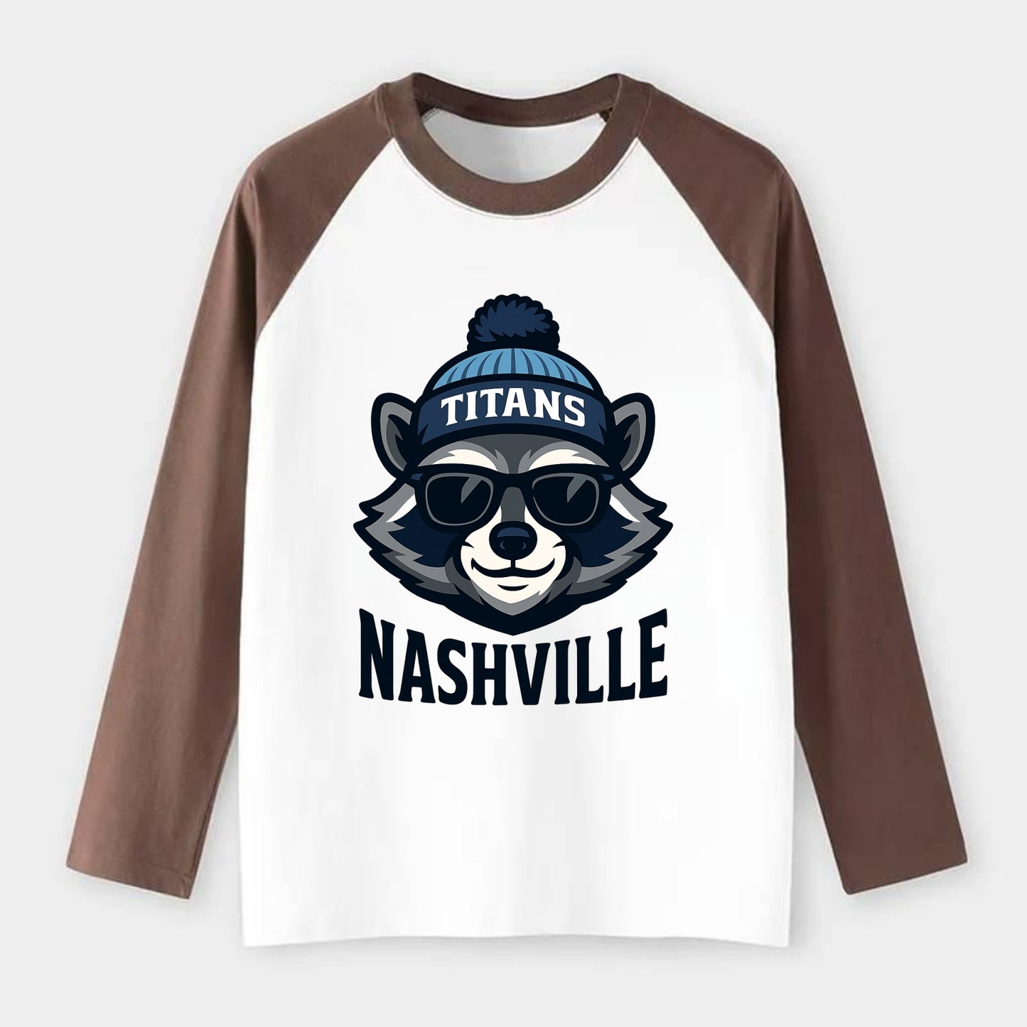 Nashville Raccoon wearing Titans navy and light blue beanie with pom - Raglan Long Sleeve T-Shirt - Coffee
