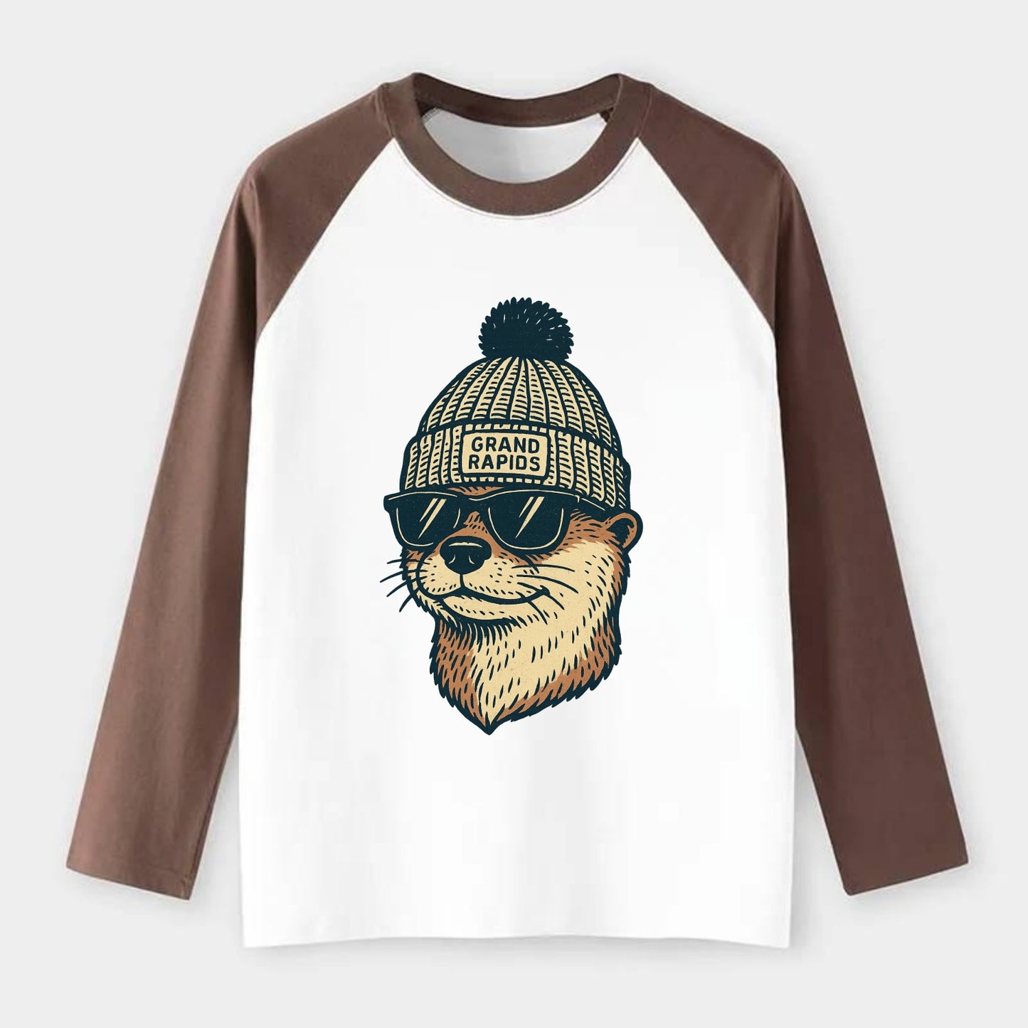 Grand Rapids River Otter wearing Grand Rapids beanie with pom pom and - Raglan Long Sleeve T-Shirt - Coffee
