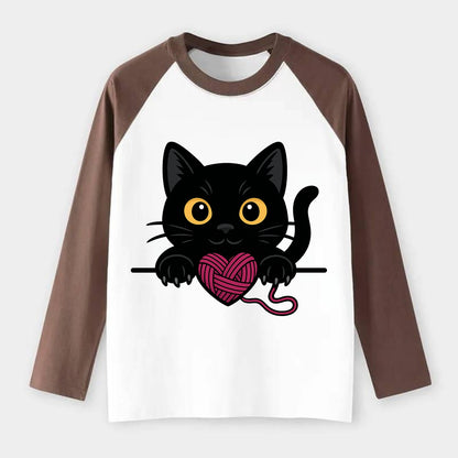 Midnight the black cat stretching tall with claws gently hooked over - Raglan Long Sleeve T-Shirt - Coffee