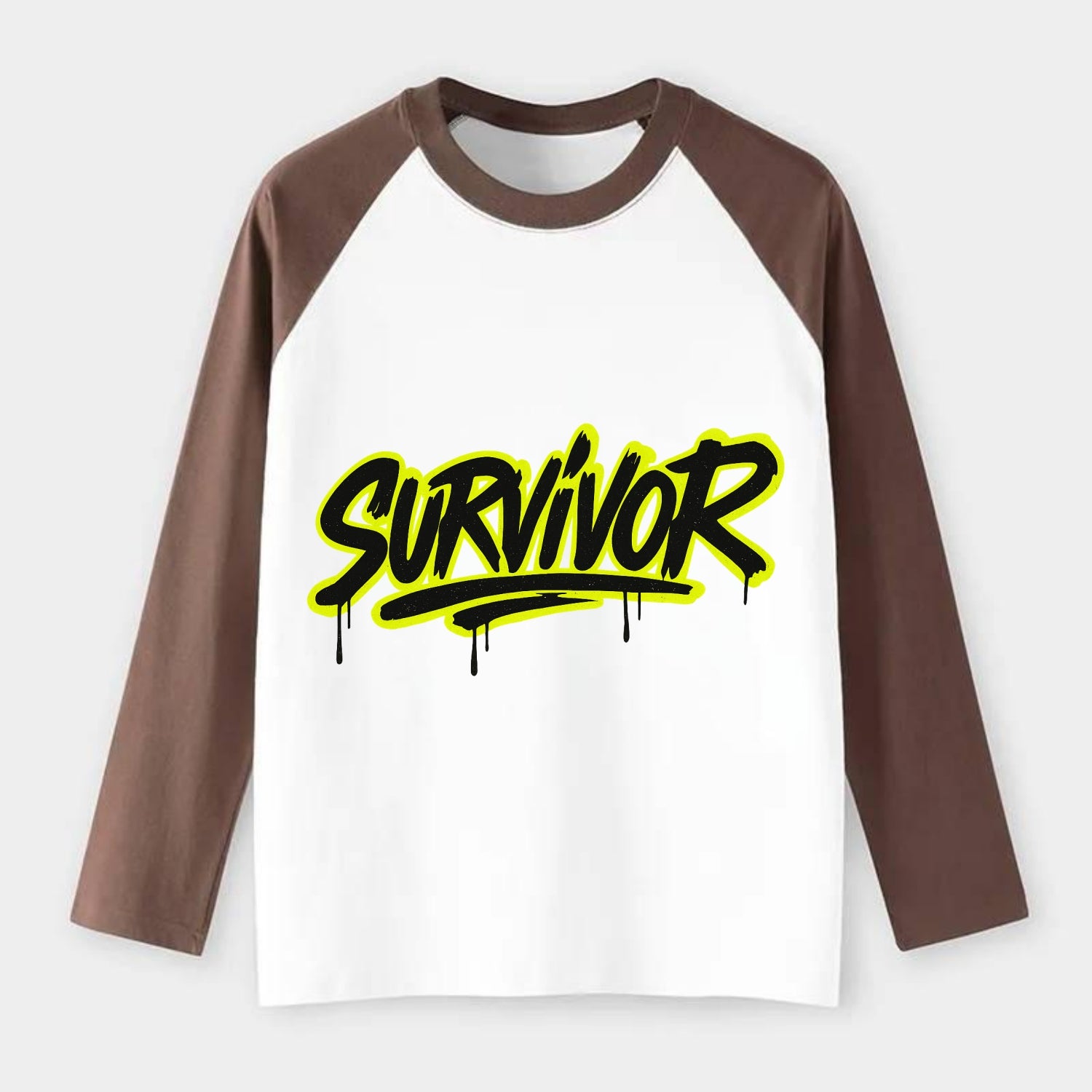 Bold typography design - "SURVIVOR" - overcomer, still standing, made - Raglan Long Sleeve T-Shirt - Coffee