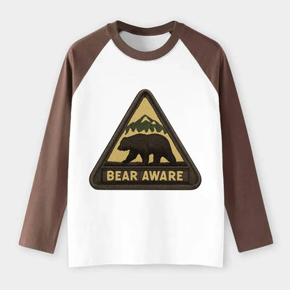 BEAR AWARE - bear silhouette warning in brown and yellow , wilderness - Raglan Long Sleeve T-Shirt - Coffee