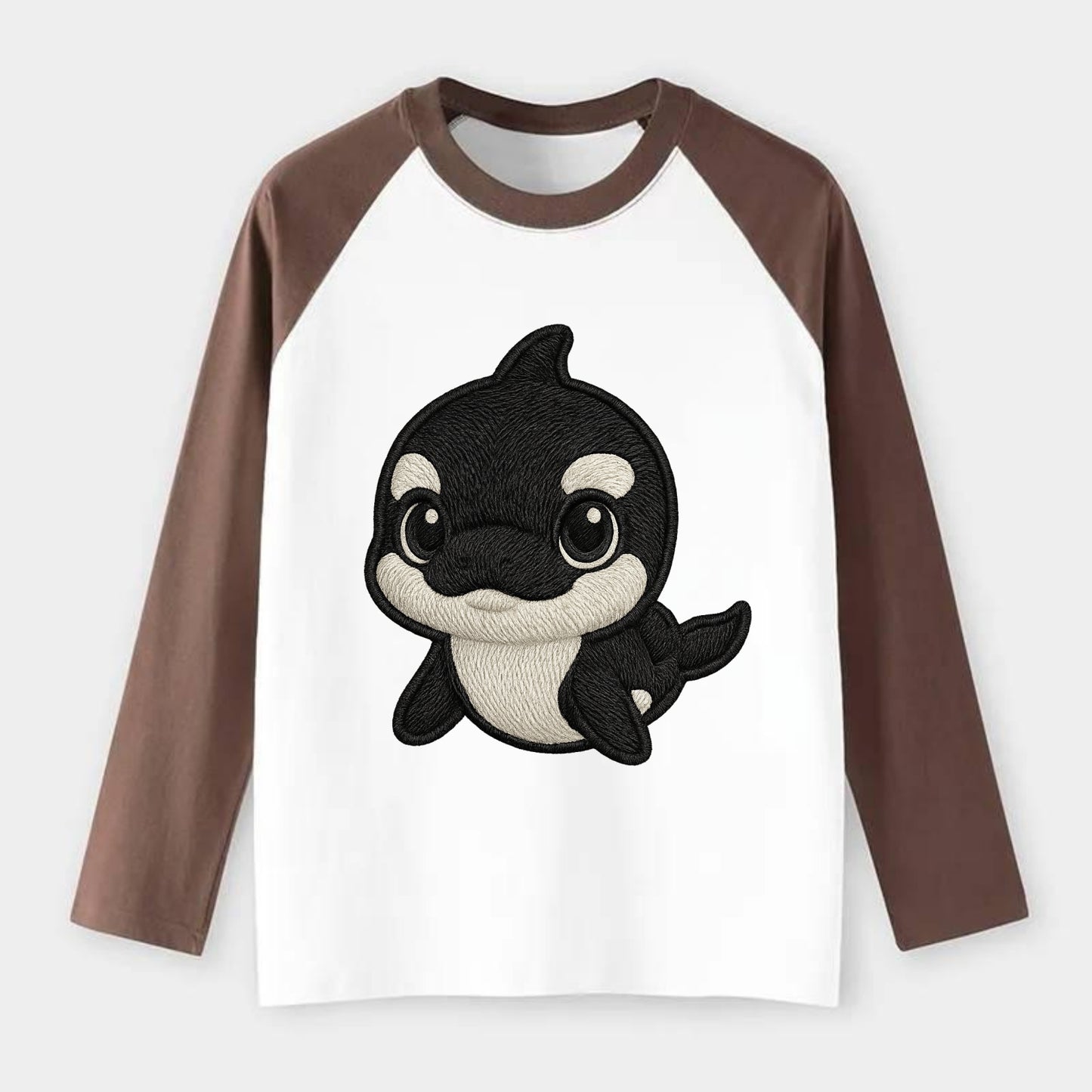 Baby Orca - black and white pattern, white eye patch, front-facing, - Raglan Long Sleeve T-Shirt - Coffee