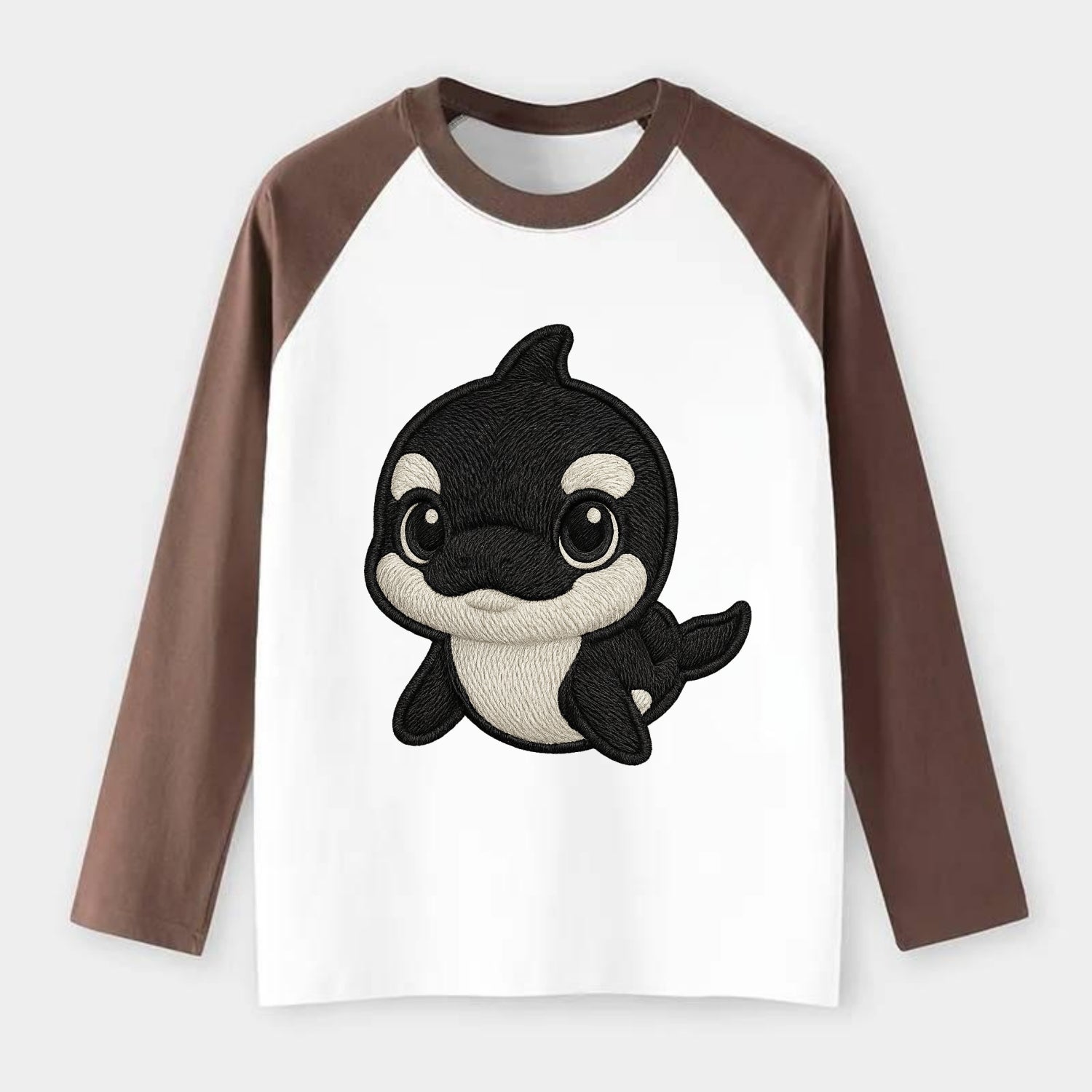 Baby Orca - black and white pattern, white eye patch, front-facing, - Raglan Long Sleeve T-Shirt - Coffee