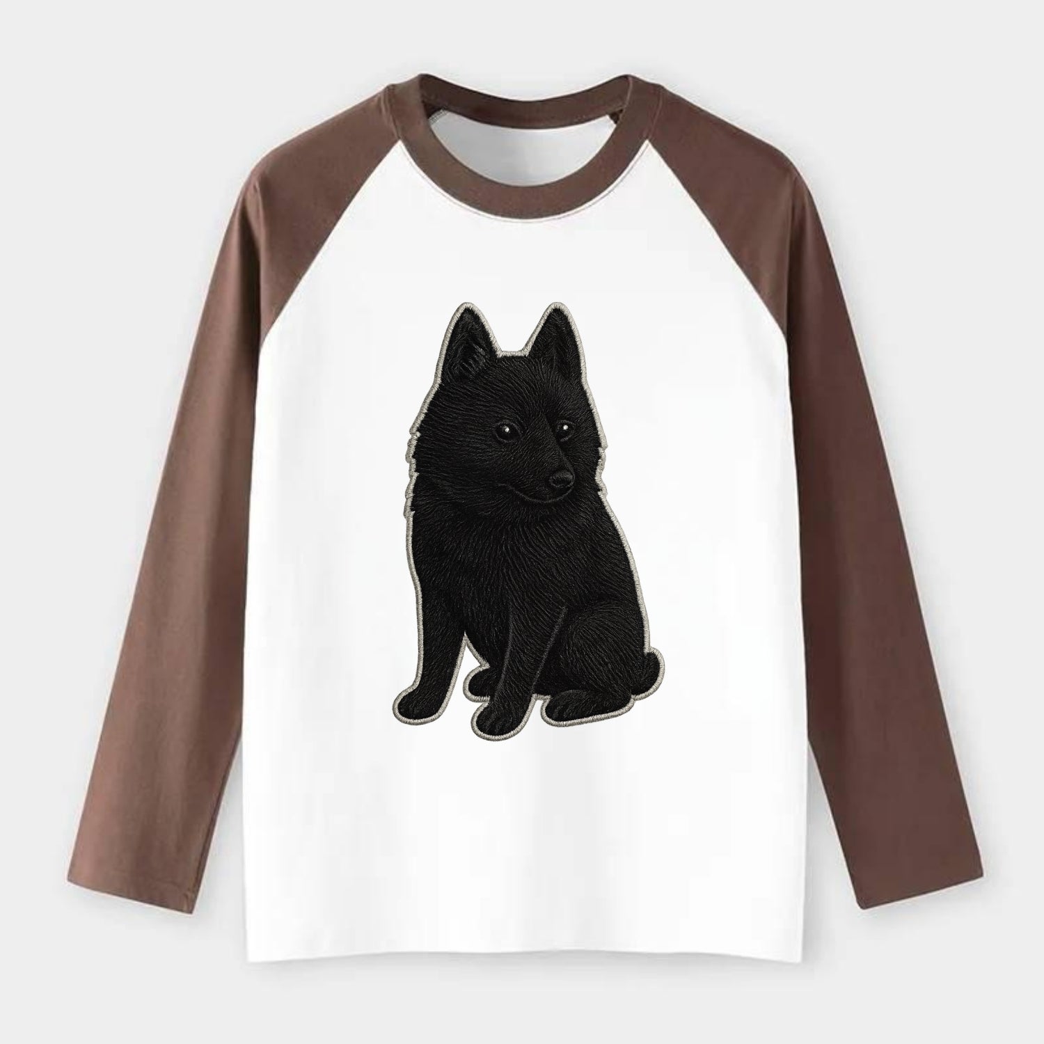 Schipperke - Solid black small embroidered sitting pose - Raglan Long Sleeve T-Shirt - Coffee