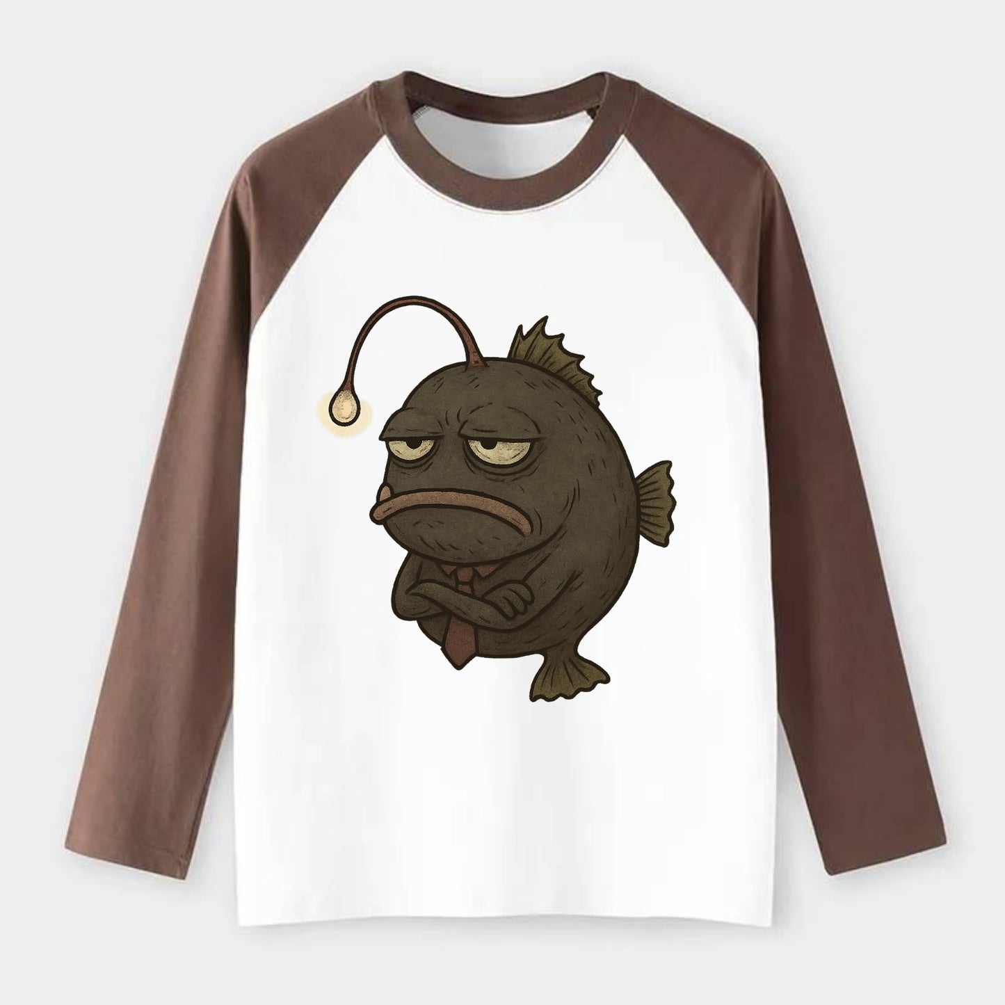 THE ANGLERFISH LURES DISAPPOINTMENT | Dark gray anglerfish with dim - Raglan Long Sleeve T-Shirt - Coffee