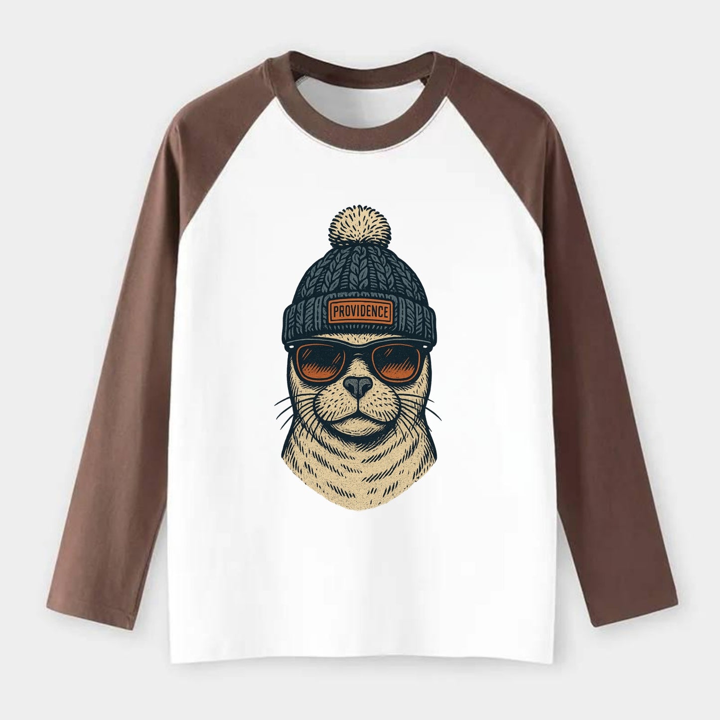 Rhode Island Harbor Seal wearing Providence beanie with pom pom and - Raglan Long Sleeve T-Shirt - Coffee