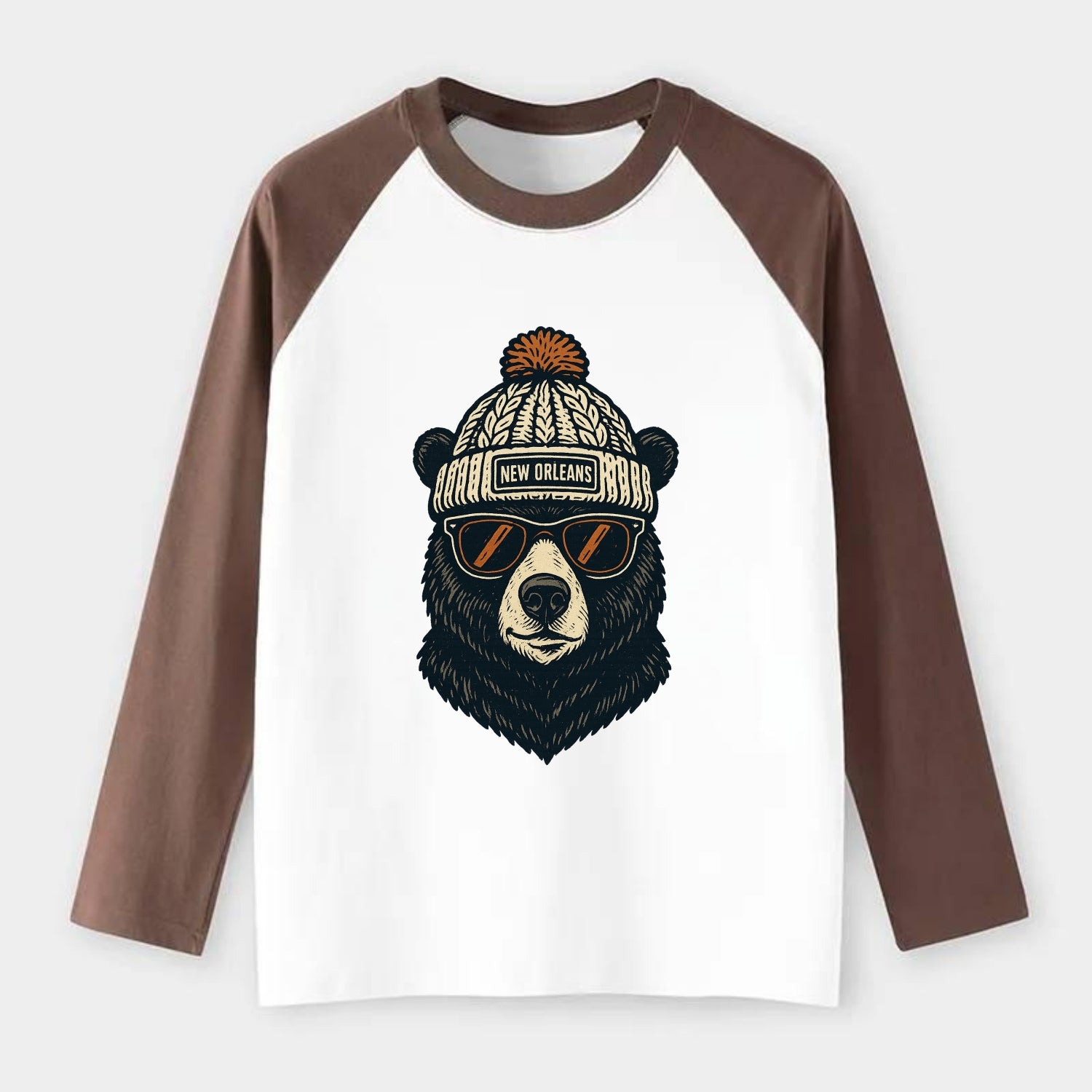 Louisiana Black Bear wearing New Orleans beanie with pom pom and - Raglan Long Sleeve T-Shirt - Coffee
