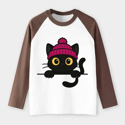 Midnight the black cat holding a tiny book labeled secrets against the - Raglan Long Sleeve T-Shirt - Coffee