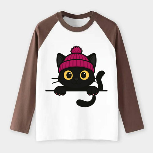 Midnight the black cat holding a tiny book labeled secrets against the - Raglan Long Sleeve T-Shirt