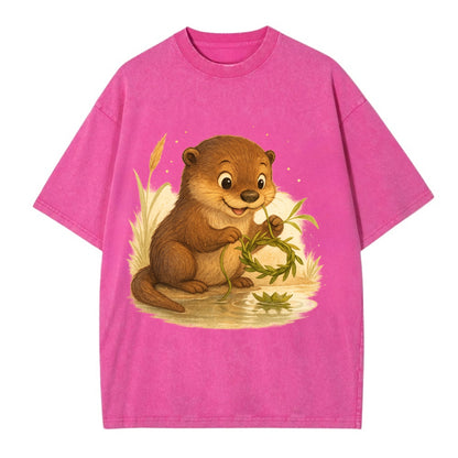 Otter weaving river reeds into a floating crown beside mirror-still water - Vintage T-shirt - Dusty Rose(Rose)