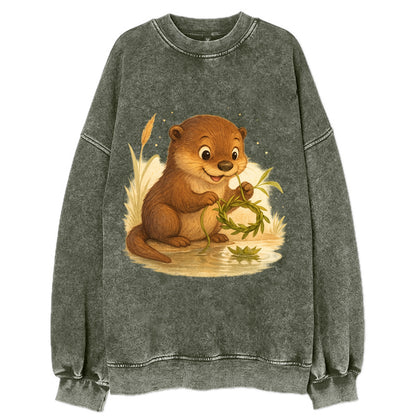 Otter weaving river reeds into a floating crown beside mirror-still water - Vintage Sweatshirt - Forest Mist(Green)