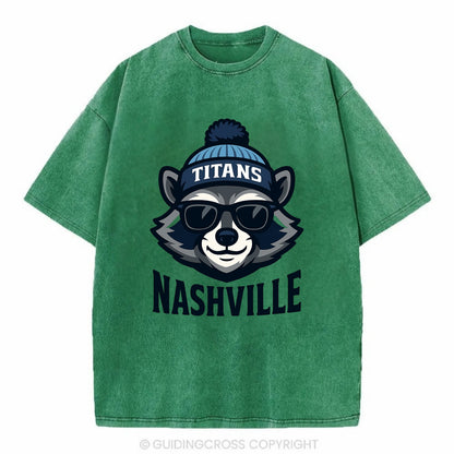 Nashville Raccoon wearing Titans navy and light blue beanie with pom pom and - Vintage T-shirt - Forest Mist(Green)